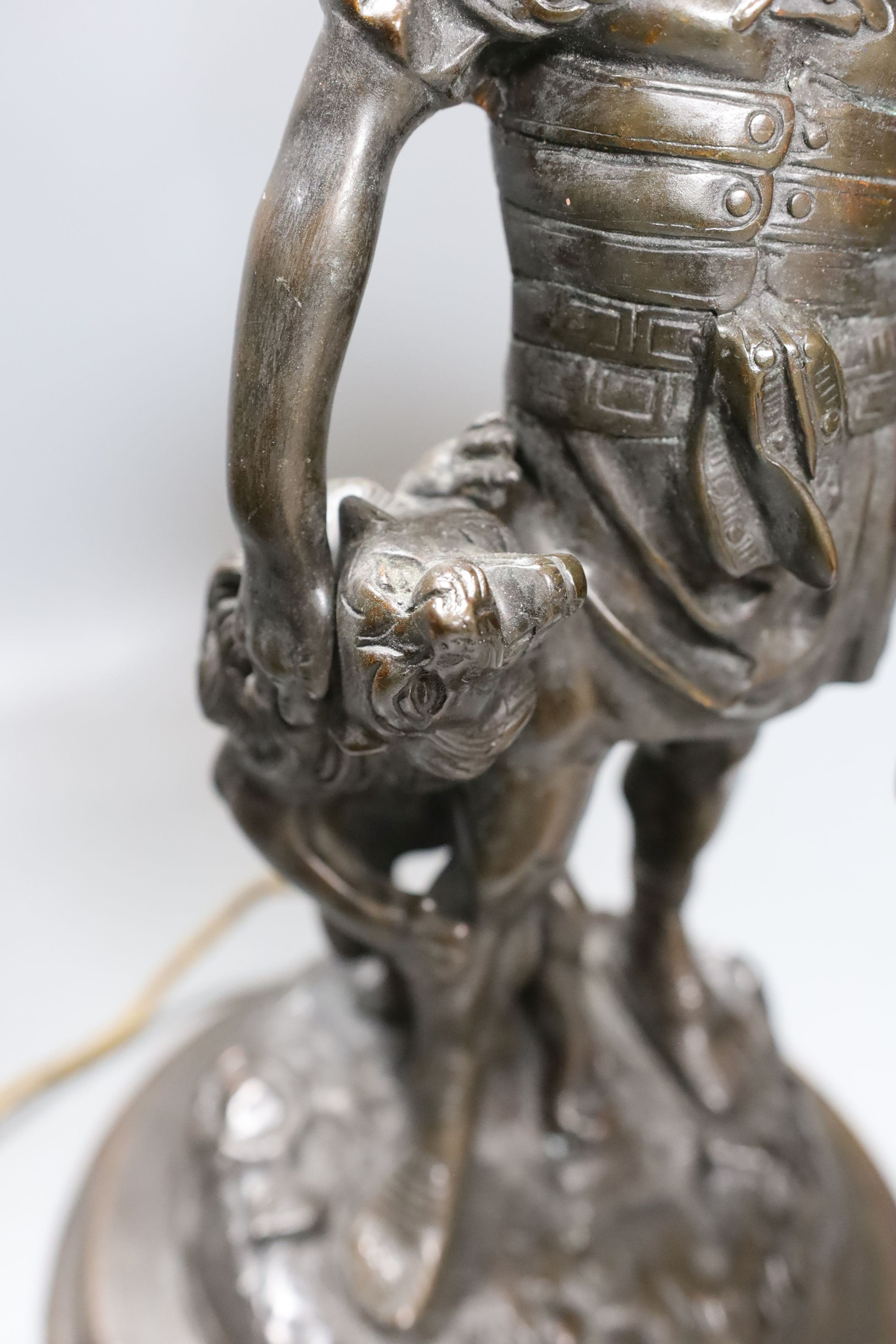 A bronze ‘gladiator’ lamp base. Total height 62cm